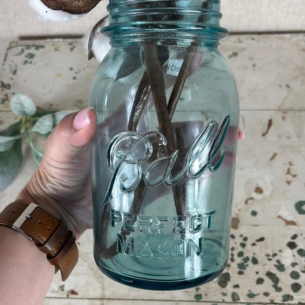 Rustic Cotton Stems in Blue Glass Vase